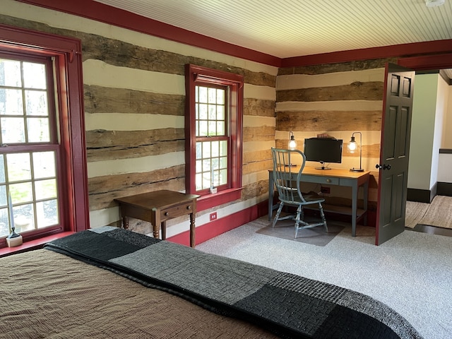 bedroom featuring carpet floors and multiple windows