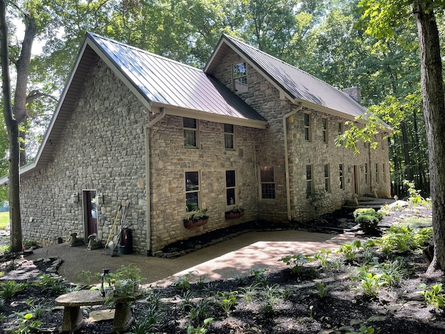 view of side of home featuring a patio