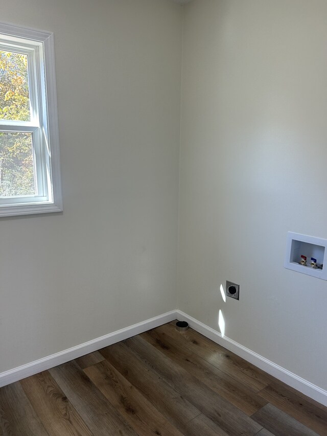 washroom with hookup for a washing machine, electric dryer hookup, and dark hardwood / wood-style floors