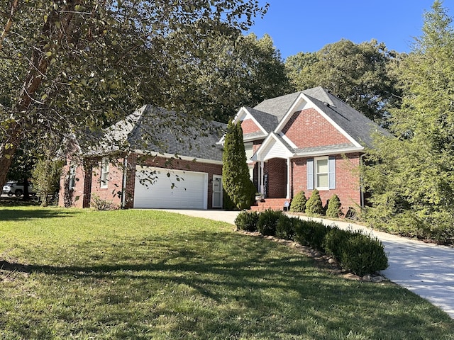 view of front of property with a front yard and a garage