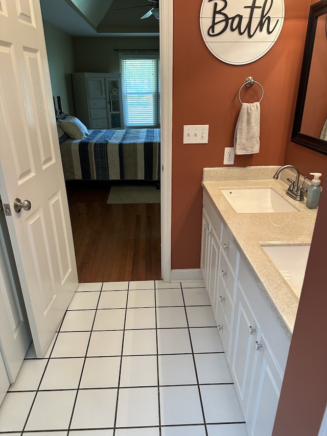 bathroom featuring hardwood / wood-style floors, vanity, and ceiling fan