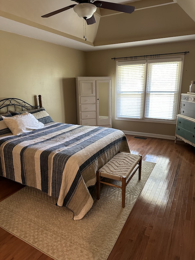 bedroom with hardwood / wood-style floors and ceiling fan