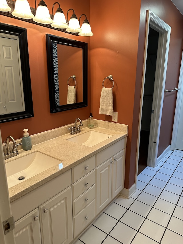 bathroom featuring tile patterned flooring and vanity