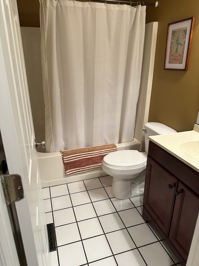 full bathroom with shower / bath combo, vanity, tile patterned flooring, and toilet