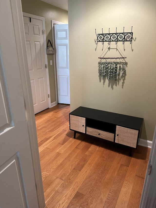 corridor featuring light hardwood / wood-style flooring