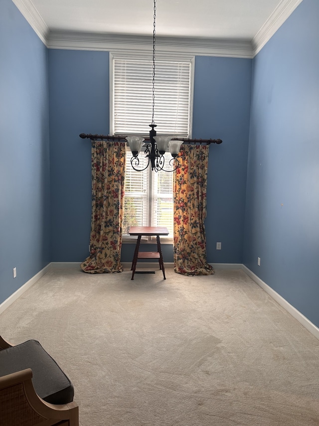 sitting room with a notable chandelier, crown molding, and carpet