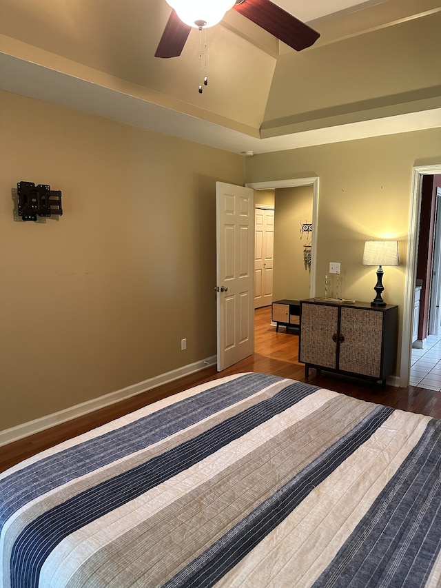 bedroom with ceiling fan and hardwood / wood-style flooring