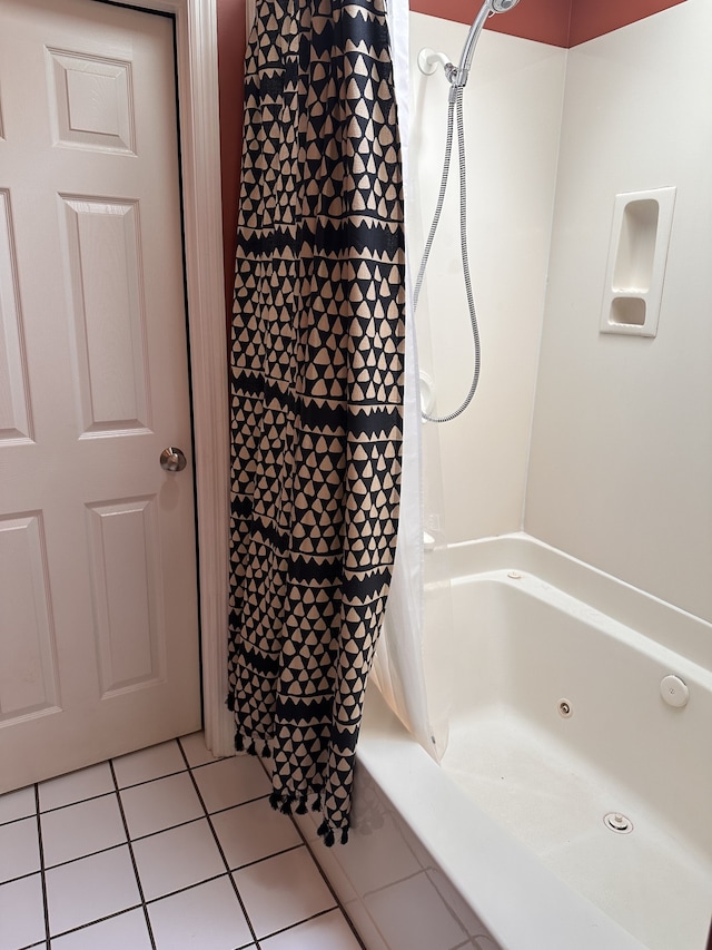 bathroom featuring tile patterned flooring and shower / bathtub combination with curtain