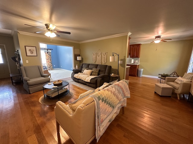 living room featuring ceiling fan, dark hardwood / wood-style floors, and crown molding