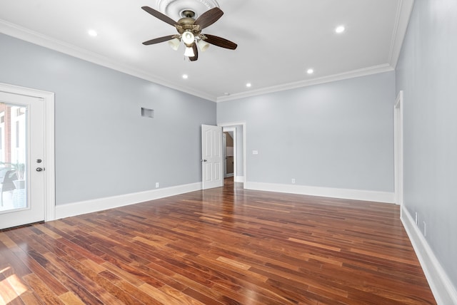 spare room with ceiling fan, ornamental molding, and dark wood-type flooring