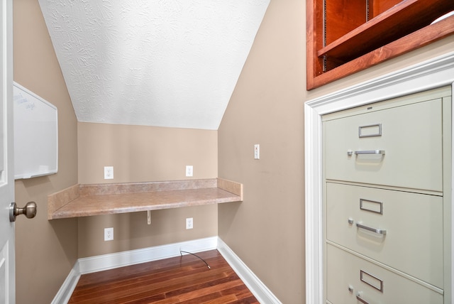 clothes washing area with dark hardwood / wood-style flooring