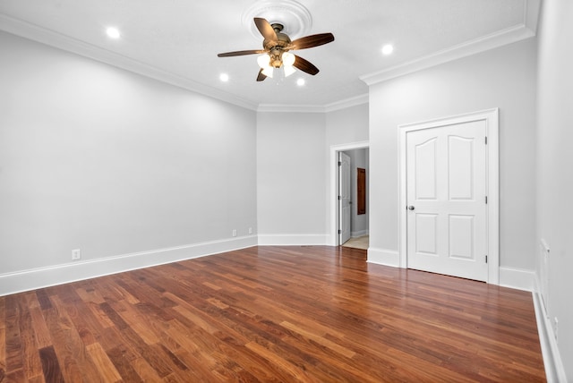 unfurnished room with crown molding, dark hardwood / wood-style flooring, and ceiling fan