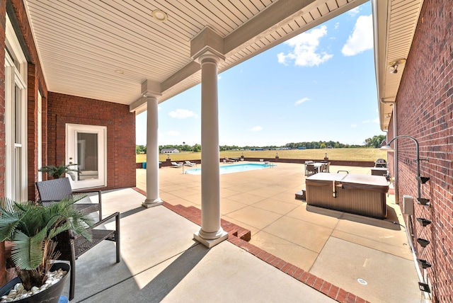 view of patio featuring a fenced in pool