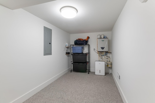 utility room featuring electric panel and tankless water heater