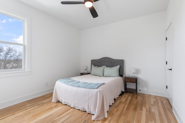 bedroom with wood-type flooring and ceiling fan