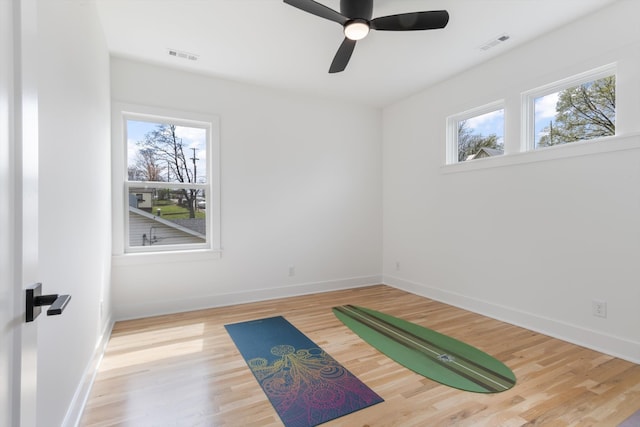 interior space with ceiling fan and hardwood / wood-style floors