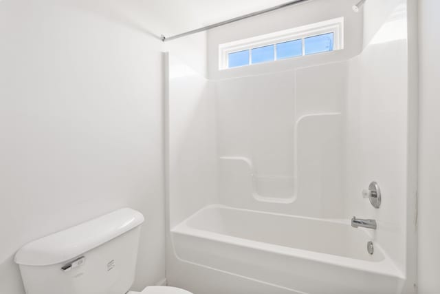 bathroom featuring toilet and shower / washtub combination