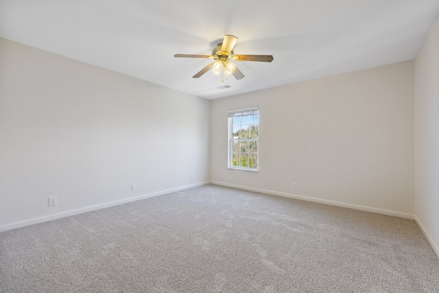 unfurnished room with carpet flooring and ceiling fan