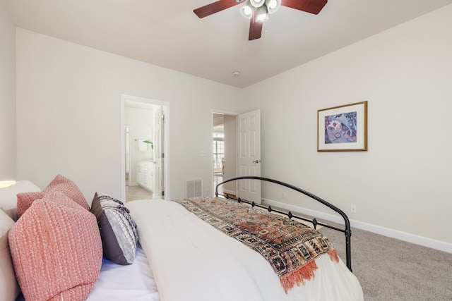 bedroom with light carpet, ceiling fan, and connected bathroom