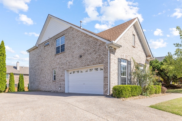 view of property exterior featuring a garage