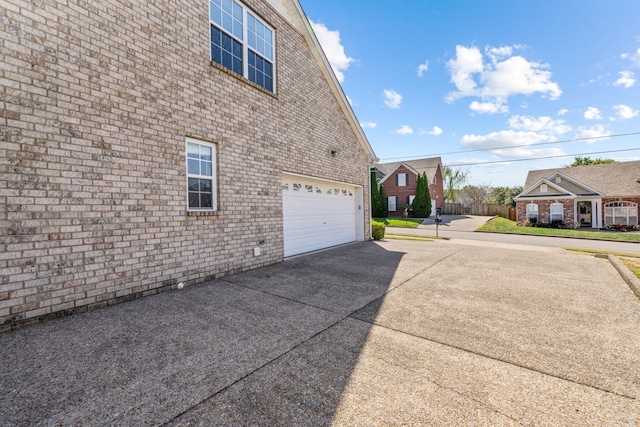 view of side of property featuring a garage