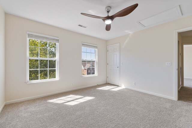 carpeted empty room with ceiling fan