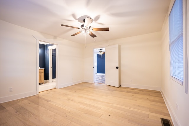 spare room with ceiling fan and light hardwood / wood-style flooring