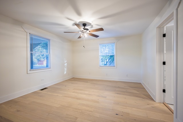 empty room featuring ceiling fan and light wood-type flooring