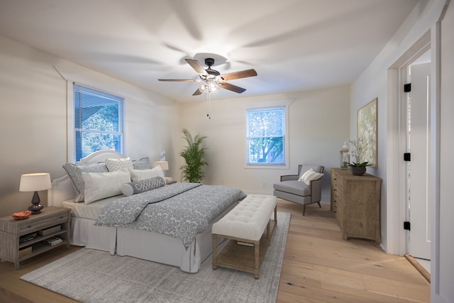 bedroom featuring light wood-type flooring and ceiling fan