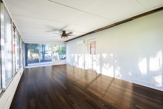 unfurnished sunroom featuring a wall mounted air conditioner and ceiling fan