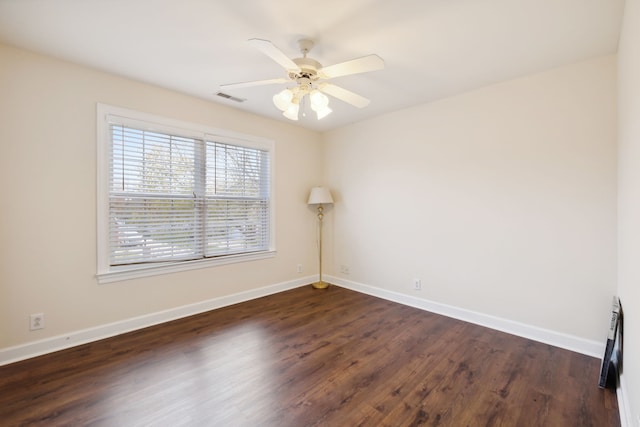 unfurnished room featuring dark hardwood / wood-style flooring and ceiling fan