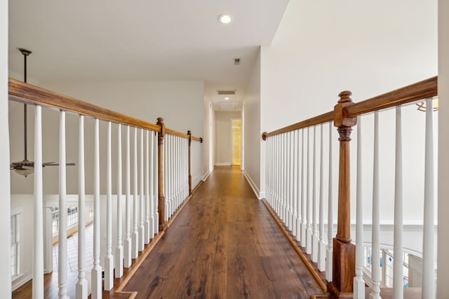 hallway featuring dark hardwood / wood-style flooring and a healthy amount of sunlight