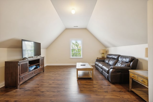 living room featuring dark wood-type flooring and lofted ceiling