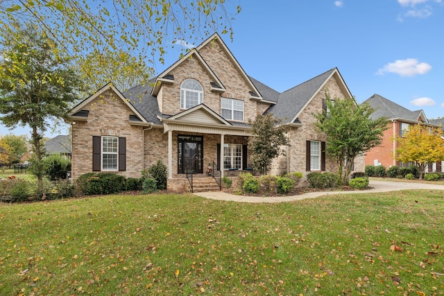 craftsman-style home featuring a front lawn