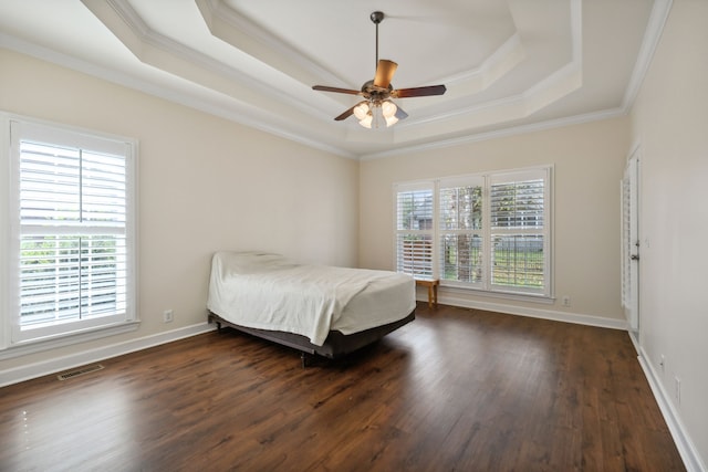 bedroom with dark hardwood / wood-style flooring, multiple windows, and ceiling fan