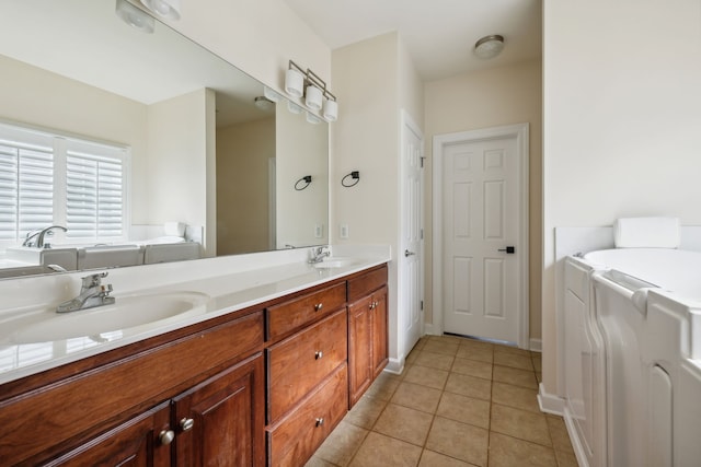 bathroom featuring a bathtub, vanity, and tile patterned floors