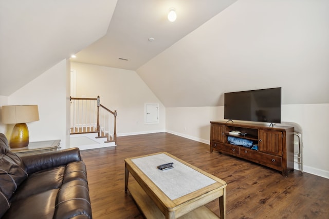 living room with vaulted ceiling and dark hardwood / wood-style flooring