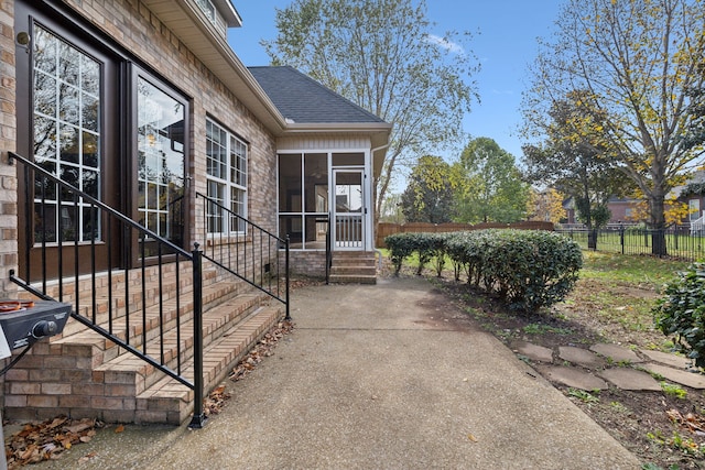 view of patio with a sunroom