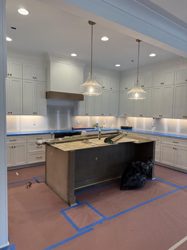 kitchen with recessed lighting, white cabinets, and light countertops