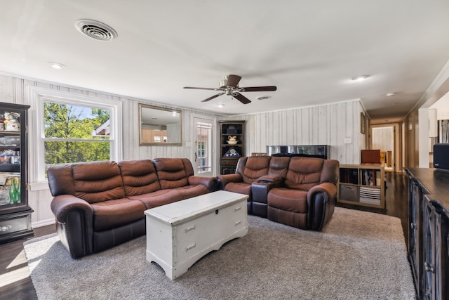 living room with ceiling fan and hardwood / wood-style floors