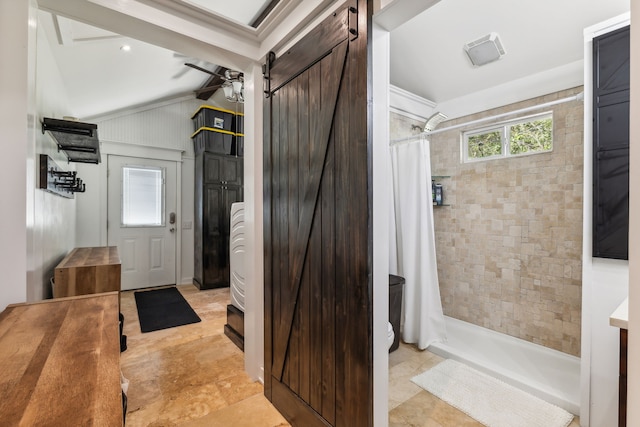 bathroom featuring walk in shower, vaulted ceiling, and ceiling fan