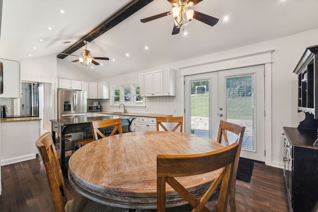 dining room featuring french doors, vaulted ceiling with beams, dark wood-type flooring, and sink