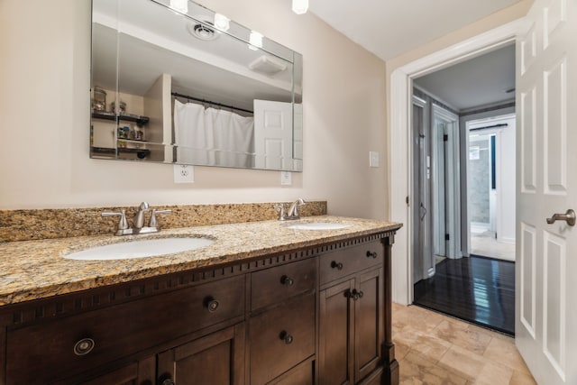 bathroom featuring wood-type flooring and vanity