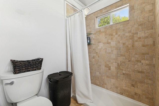 bathroom with shower / tub combo with curtain and toilet