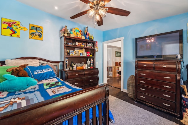 bedroom featuring ceiling fan and dark hardwood / wood-style floors