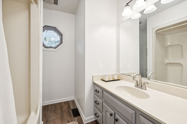 bathroom with wood-type flooring and vanity