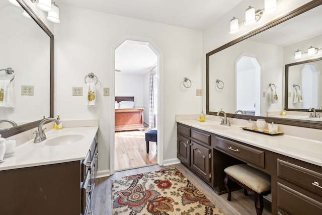 bathroom featuring vanity and hardwood / wood-style flooring