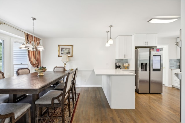 dining area with dark hardwood / wood-style flooring