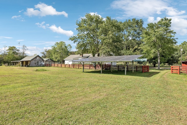 view of yard with a rural view