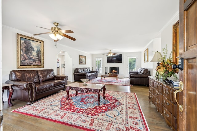 living room featuring crown molding, hardwood / wood-style flooring, and ceiling fan